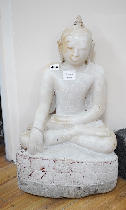 An 18th century Burmese marble Buddha, 57cm high. Condition - commensurate with age